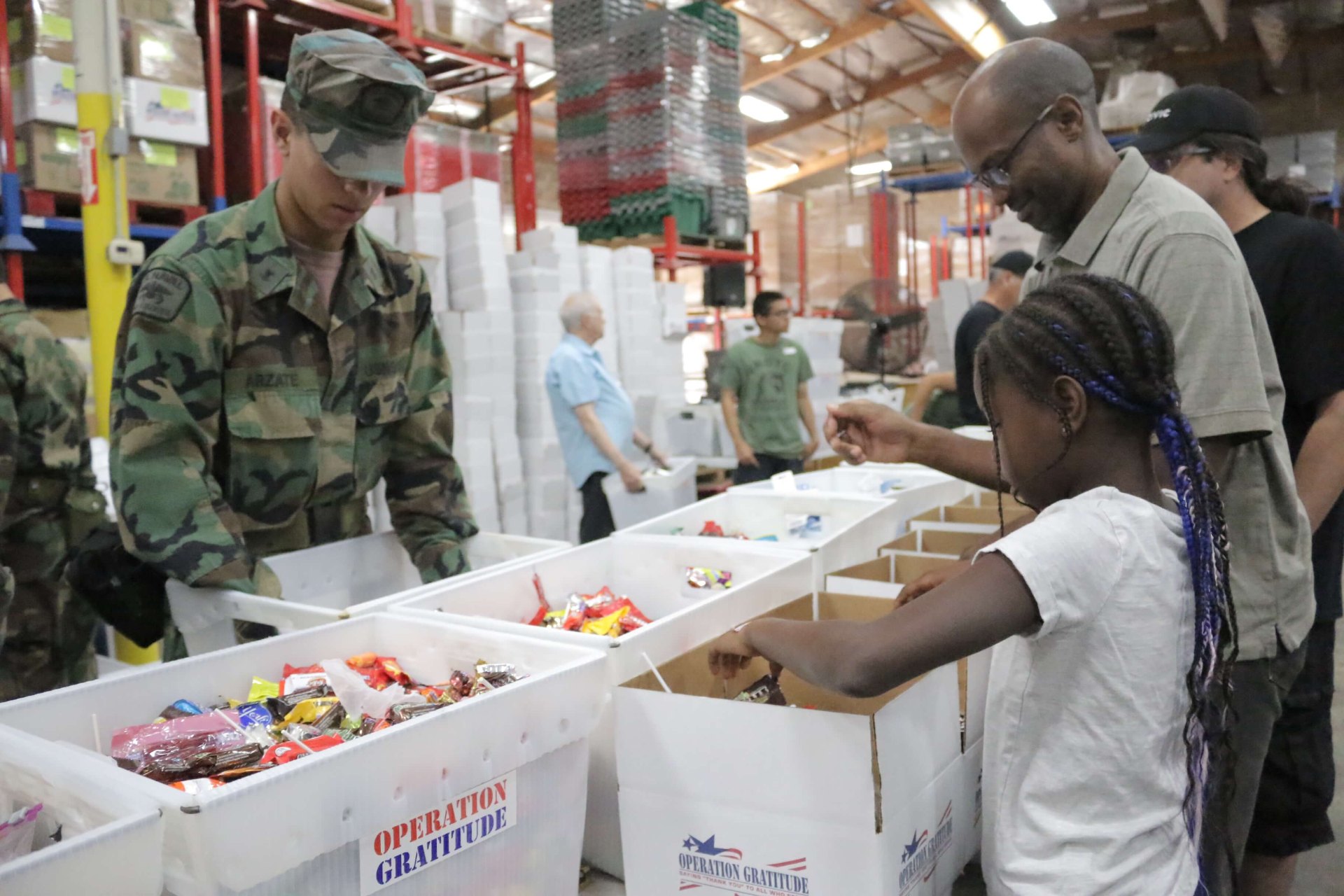Volunteers assembling care packages